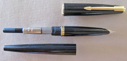 #6424 & 6425: ENGLISH MADE PARKER 45 IN BLACK. PLACTIC CAP WITH GOLD PLATED TRIM. 6424 HAS MED NIB. 6425 HAS BROAD NIB + CLEAR ORIGIONAL CHALK MARK "45 DE-LUX M".